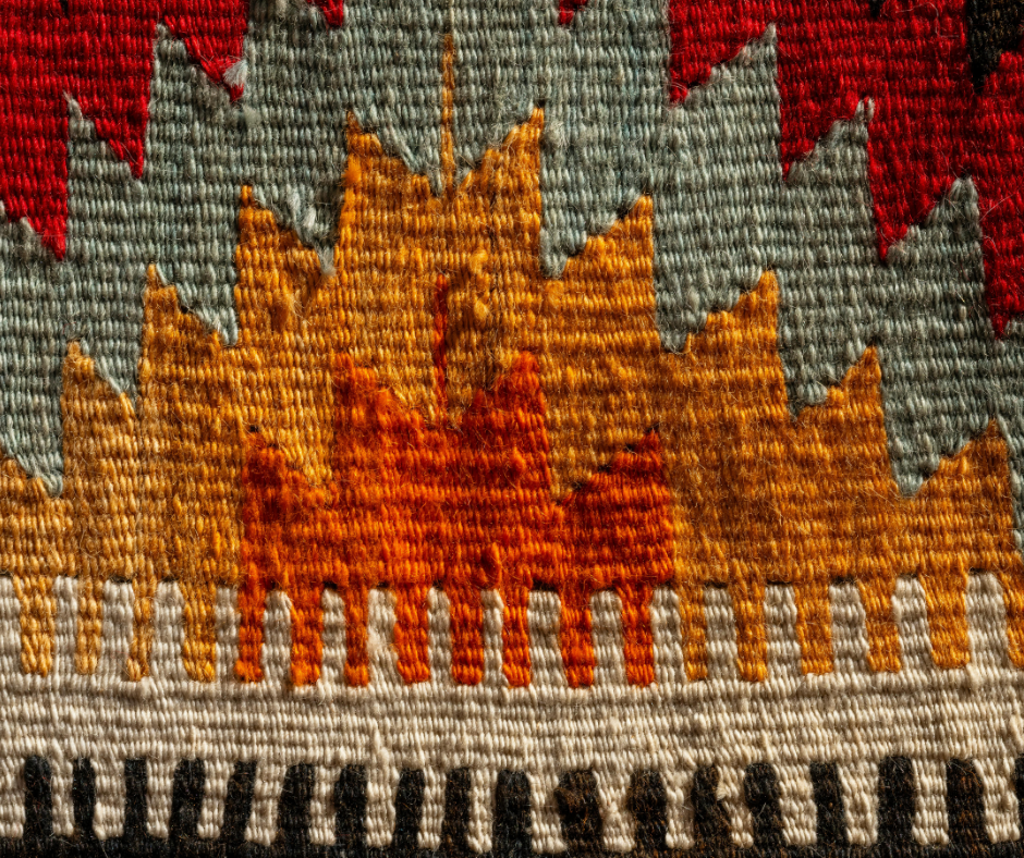 handmade rug with carpet fibers in red, orange and green