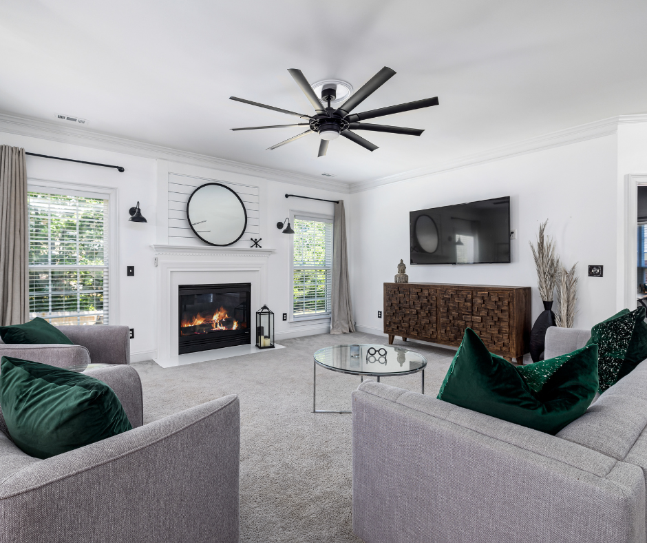 living room with couches, table, tv on carpet flooring