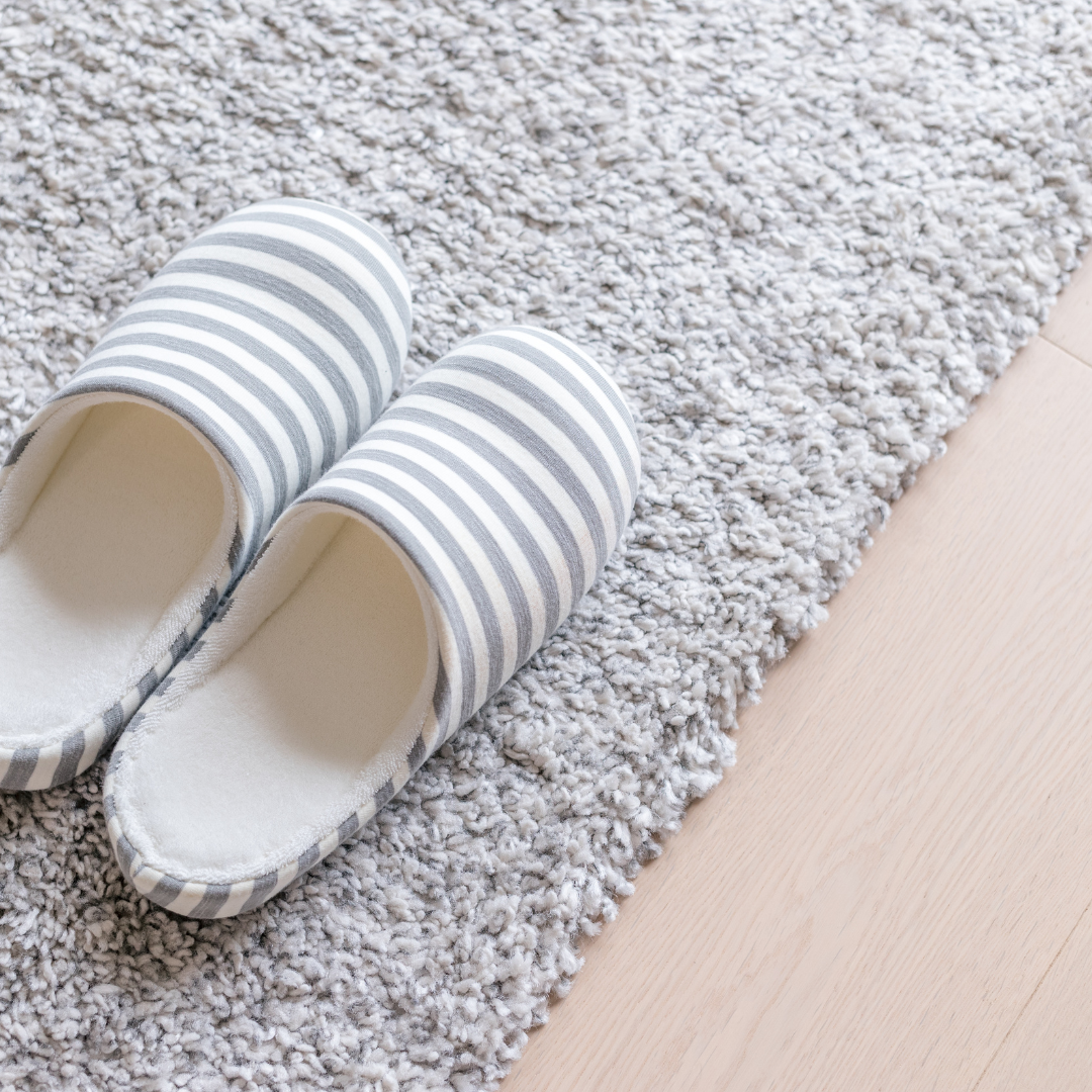 slippers on gray carpet