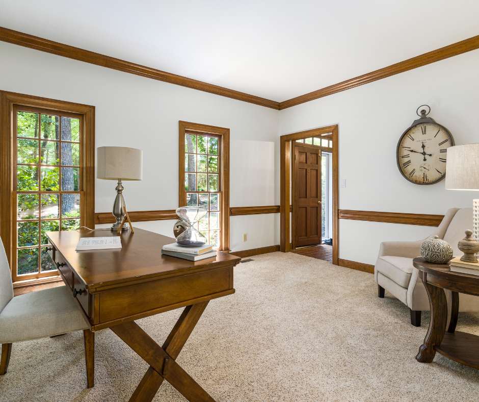 office with carpet and wooden desk and chair