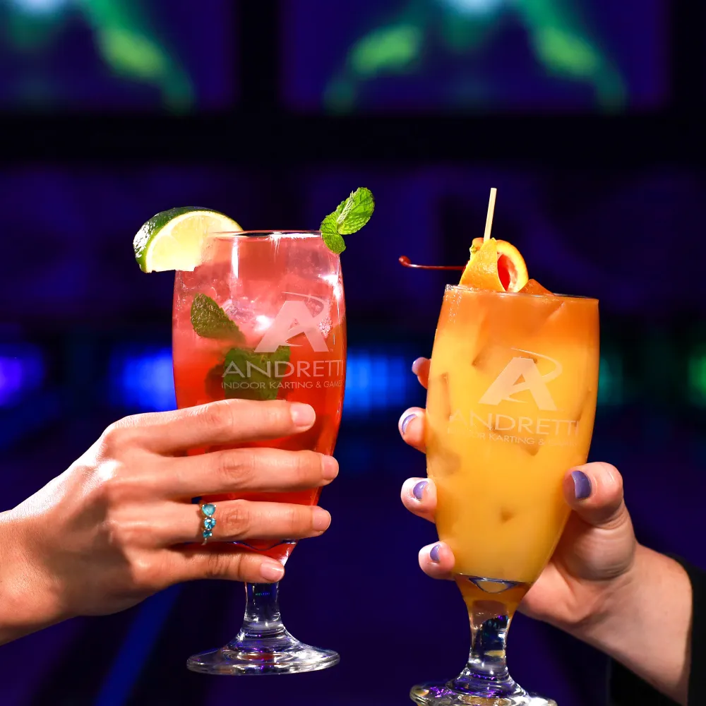 a couple of people holding drinks