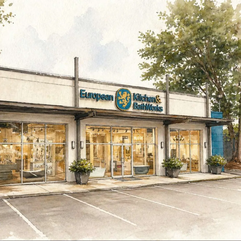 Storefront of European Kitchen & BathWorks with large windows and outdoor plants in a serene setting.