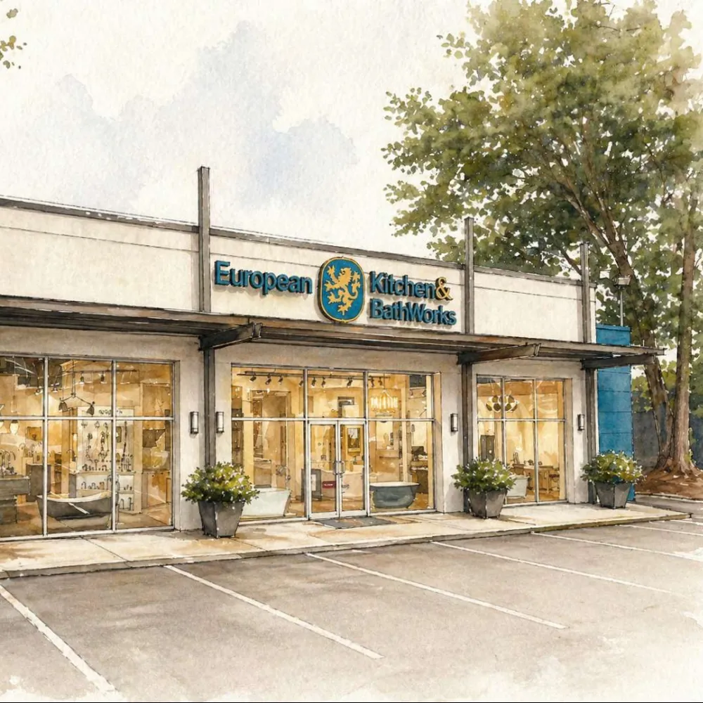 Storefront of European Kitchen & BathWorks with large windows and outdoor plants in a serene setting.