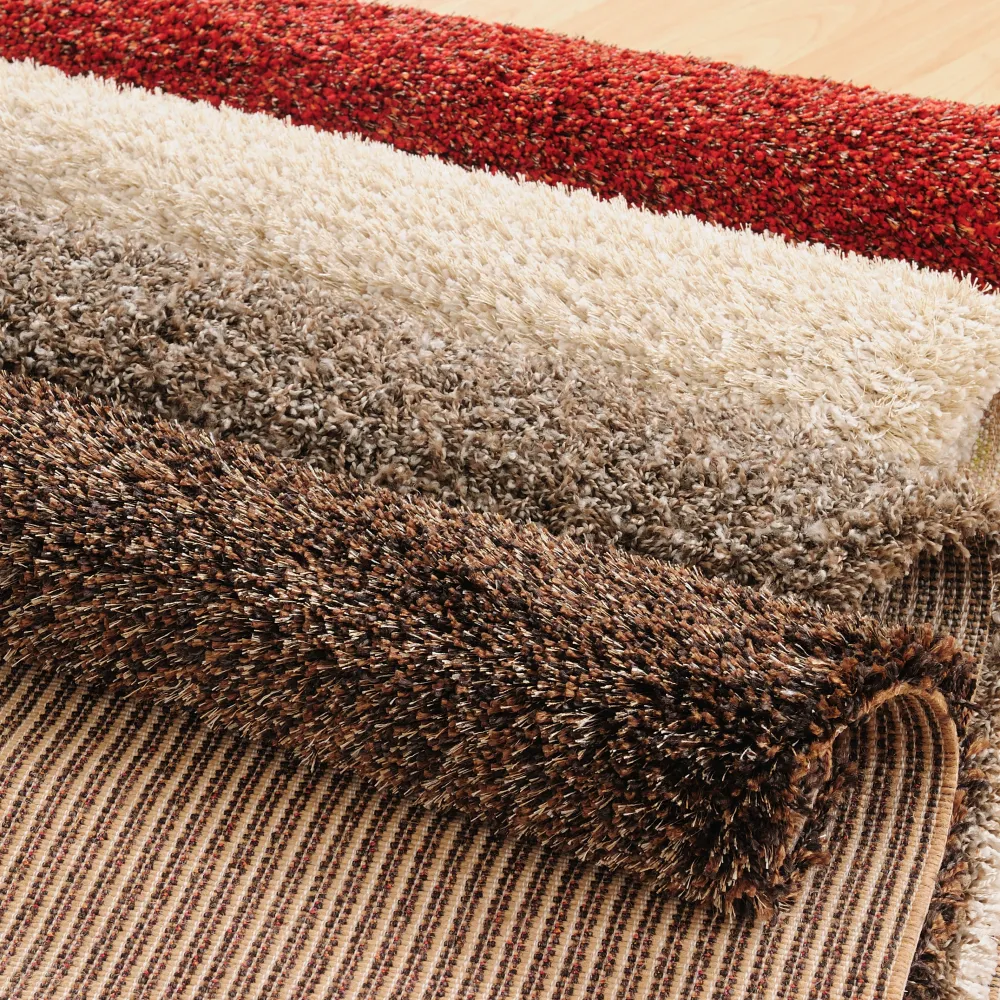 Stylish collection of plush area rugs in various colors and textures, perfect for home decor.