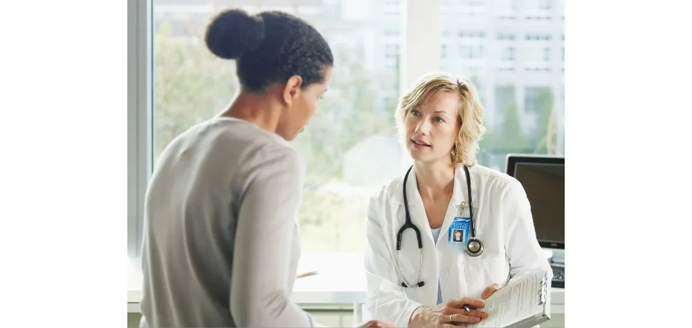 woman talking to a doctor