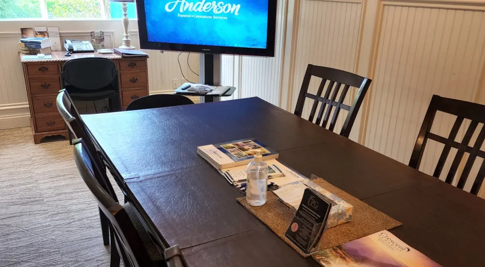 a conference room with a large screen