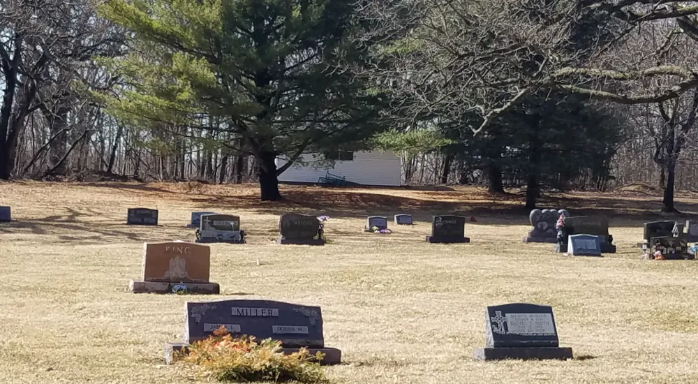 a cemetery with many gravestones