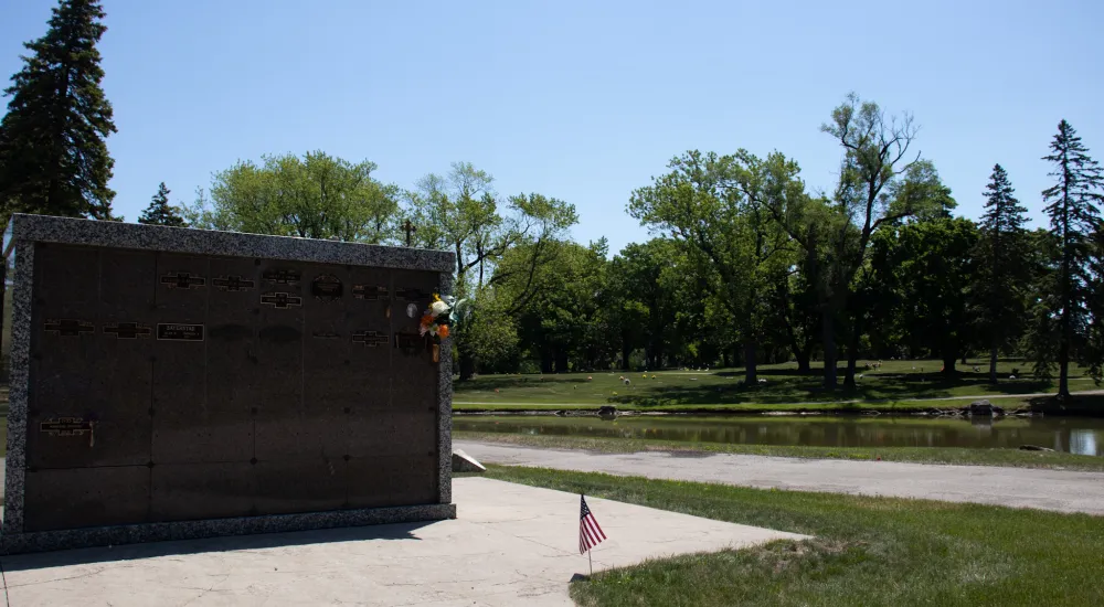 a man sitting on the side of a road