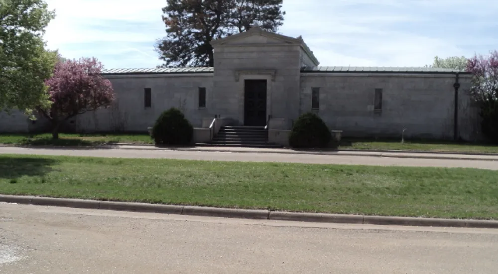 a building with a grass lawn