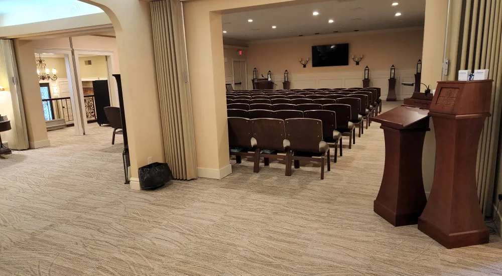 a room with a large table and chairs