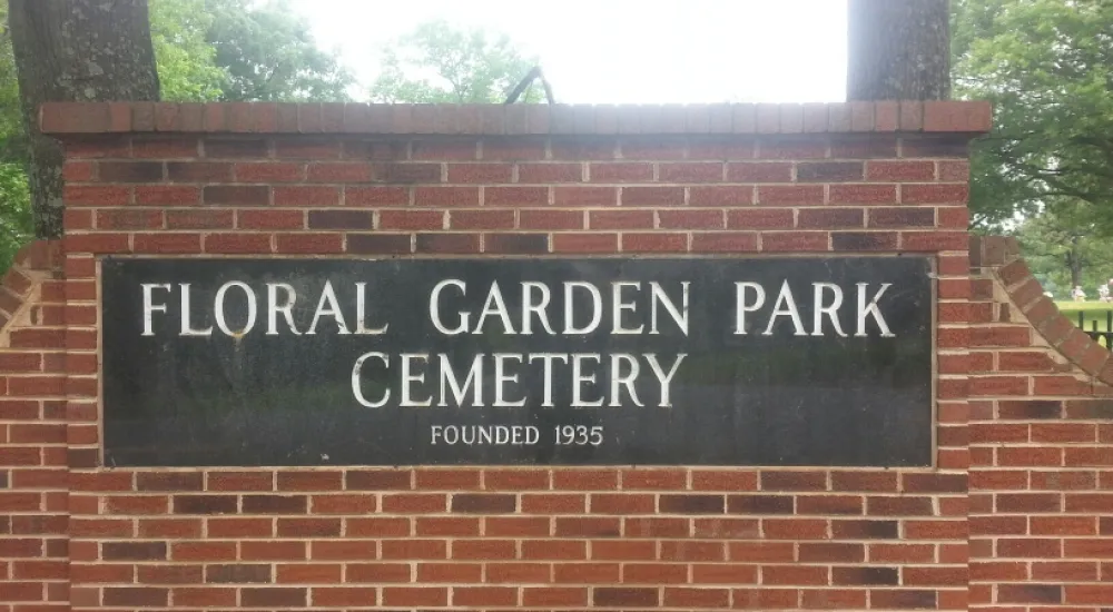 a sign on a brick wall
