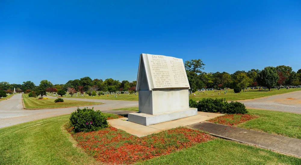 a large stone statue in a park