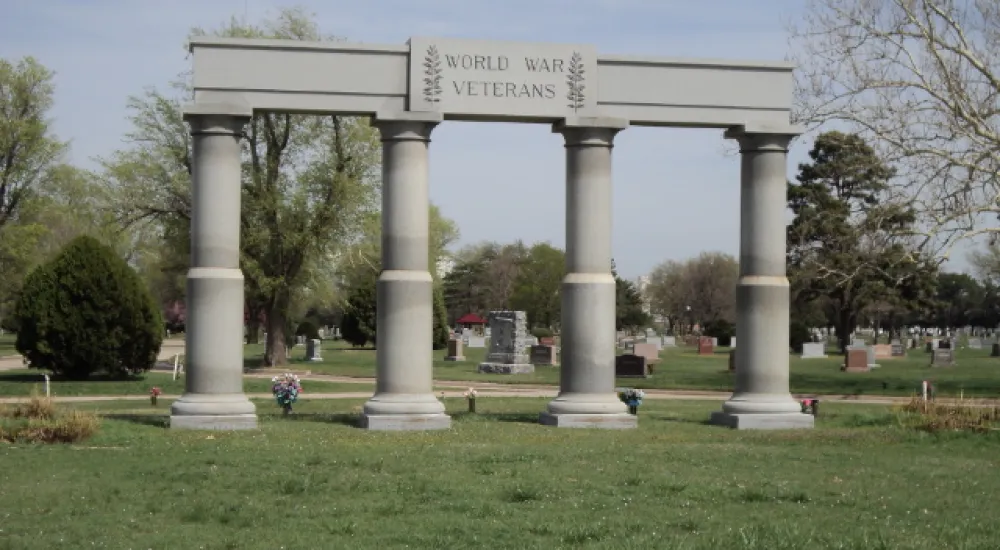 a large stone arch with columns