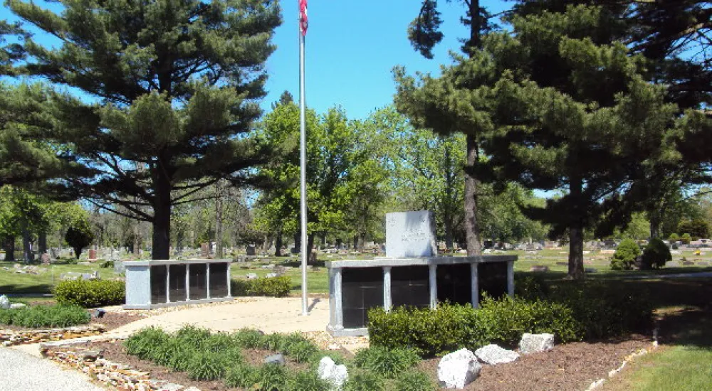 a small building with a flag on top