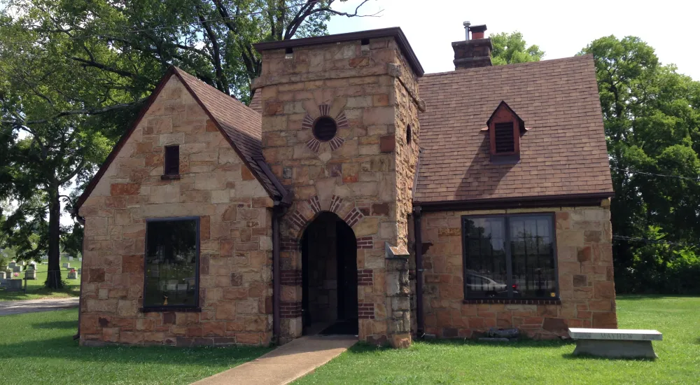 a brick building with a stone entrance