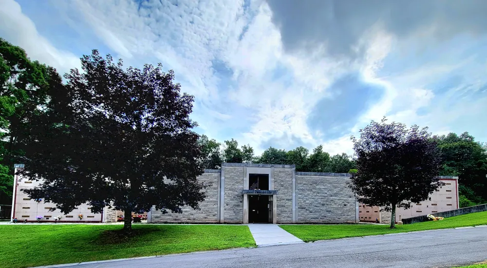 a building with trees in the front