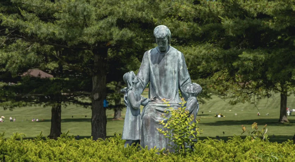 a statue of a person in a park