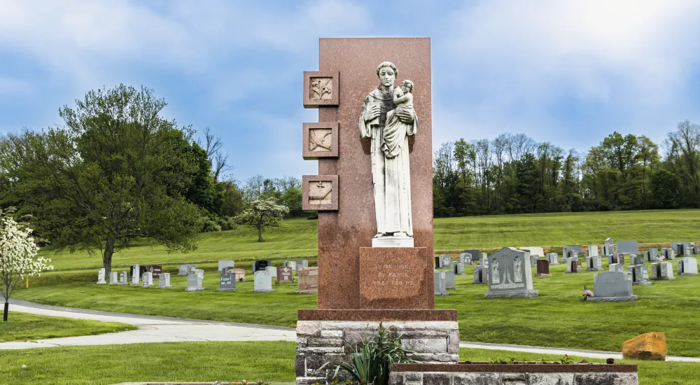 a statue in a cemetery