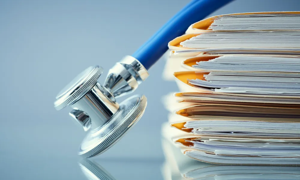 a stethoscope on a stack of books