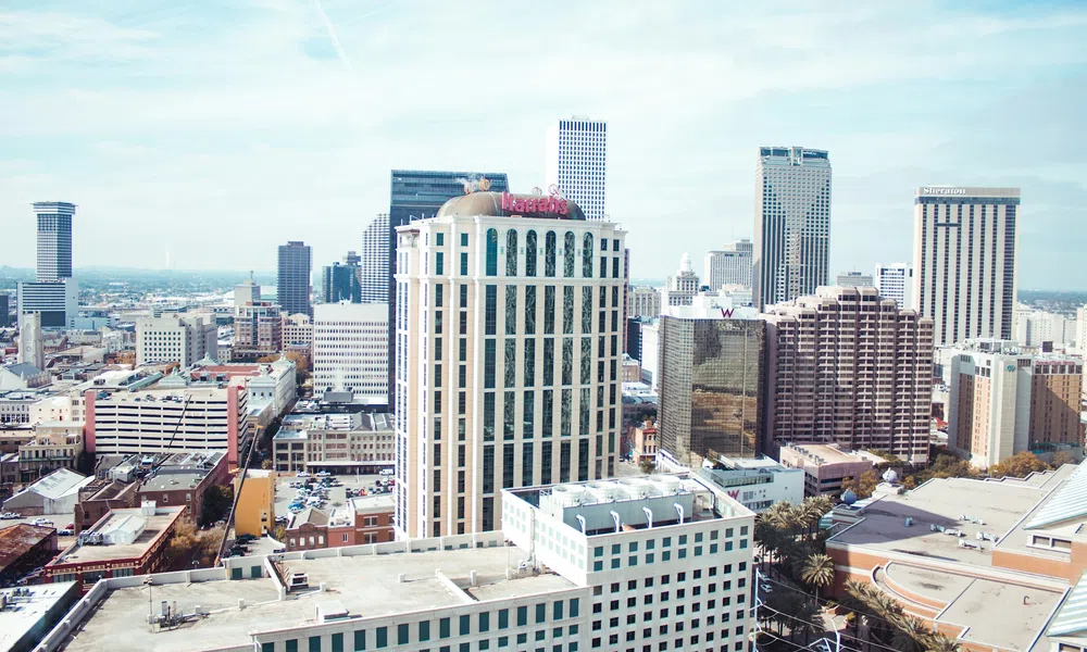 Downtown cityscape with high-rise buildings and clear blue sky in the background during daytime.