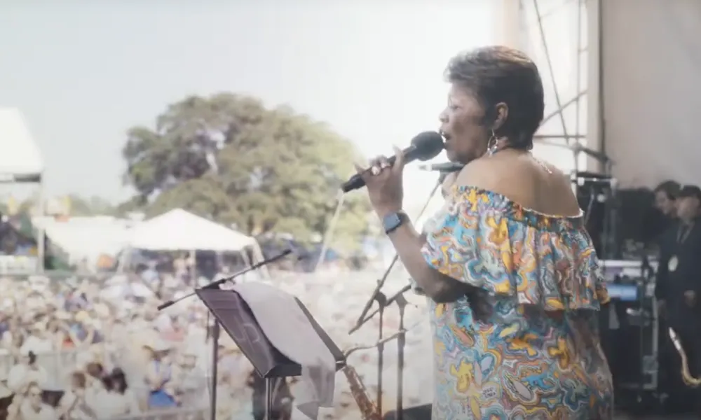 a person singing into a microphone