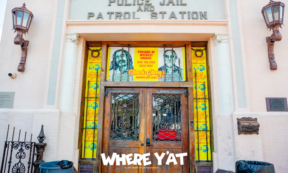 Entrance of police jail and patrol station with wooden doors and colorful posters of persons of interest.