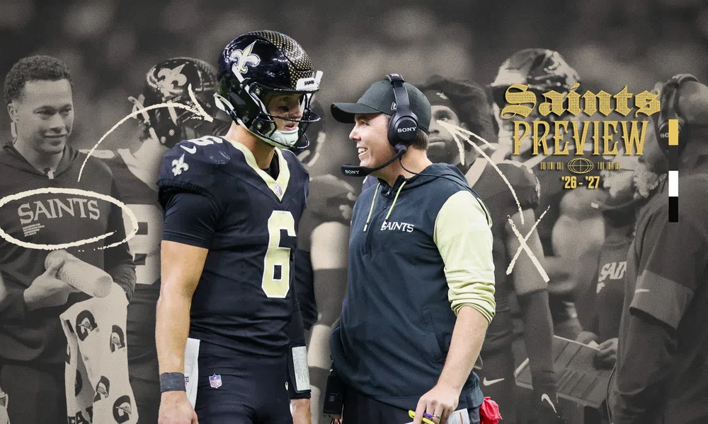New Orleans Saints player and coach discussing during game with team preview text and strategy graphics overlay.