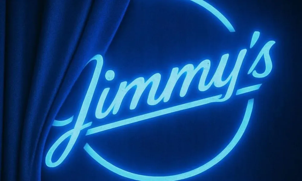 Neon blue sign announcing Jimmy's Music Club coming soon, with curtain partially covering it.