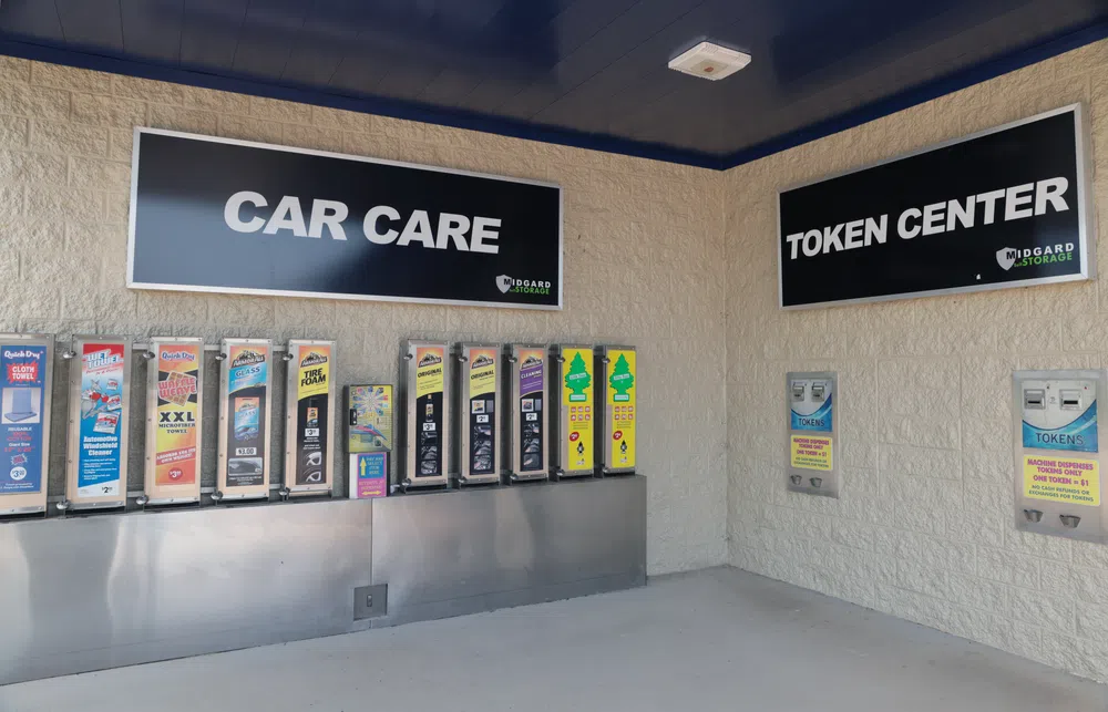 Car care vending machines and token dispensers at Midgard Storage car wash token center.