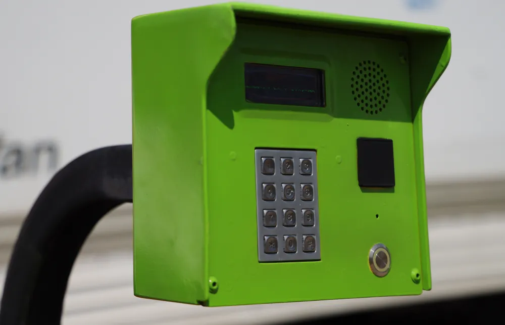 a green telephone on a table