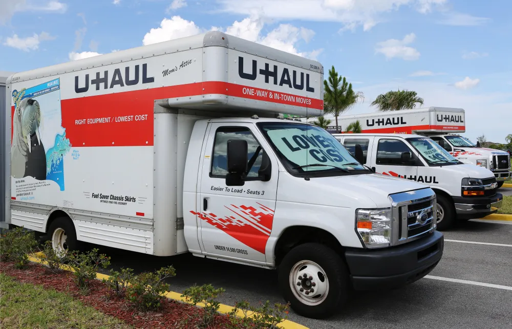 a white truck with a red and blue sign on it