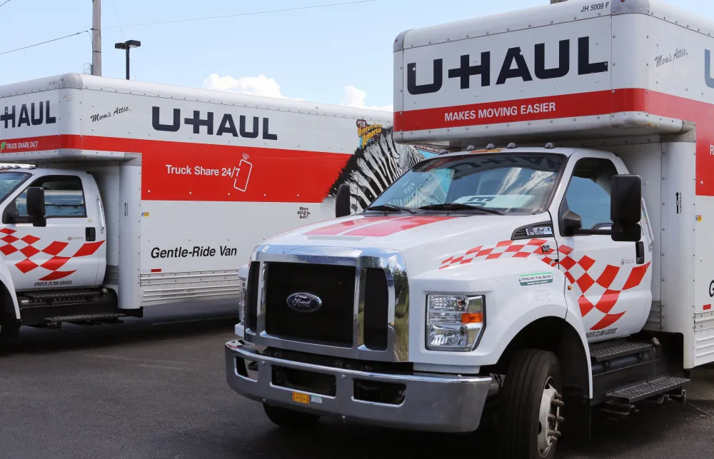 a white truck with a red stripe