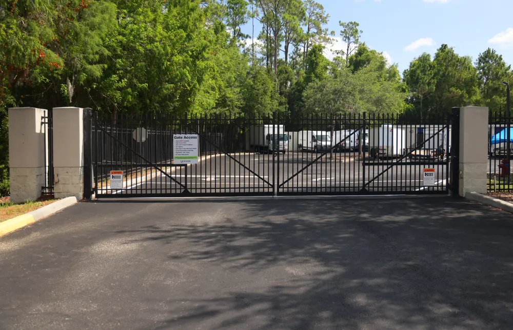 a black gate with a sign on it