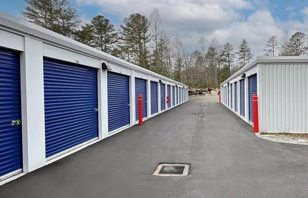 a row of white and blue sheds