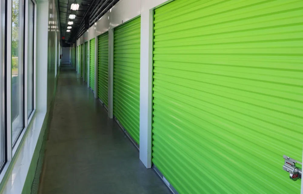 a long hallway with green walls