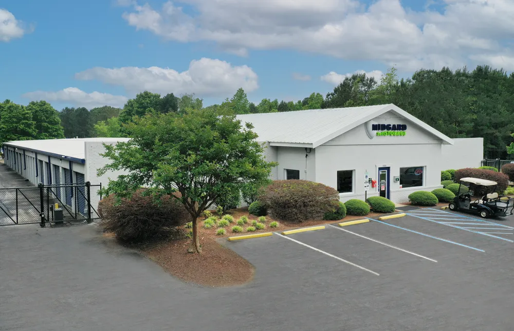 a white building with a parking lot