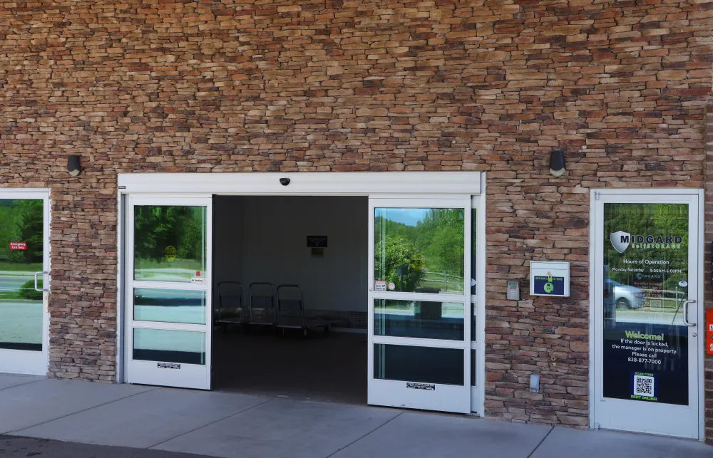 a brick building with glass doors