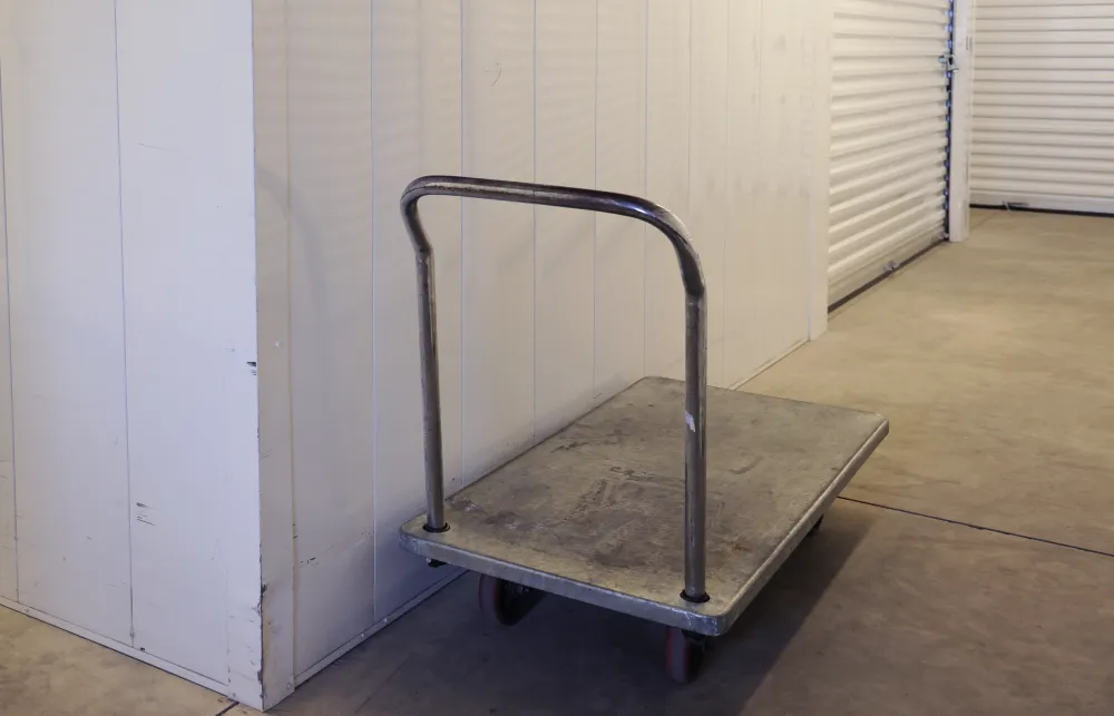 a metal cart on a wooden floor