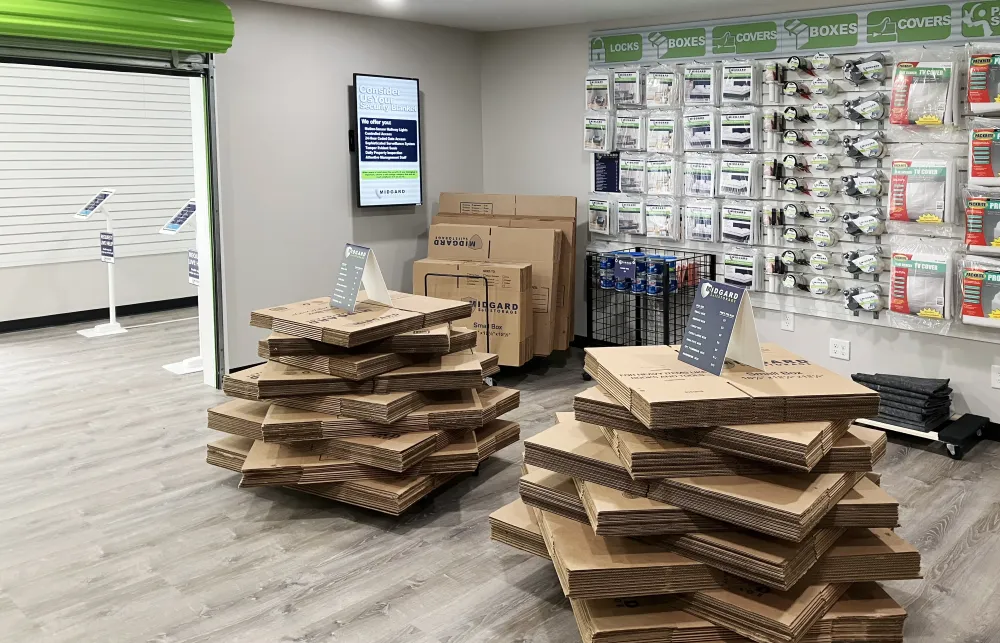 a room with shelves of boxes