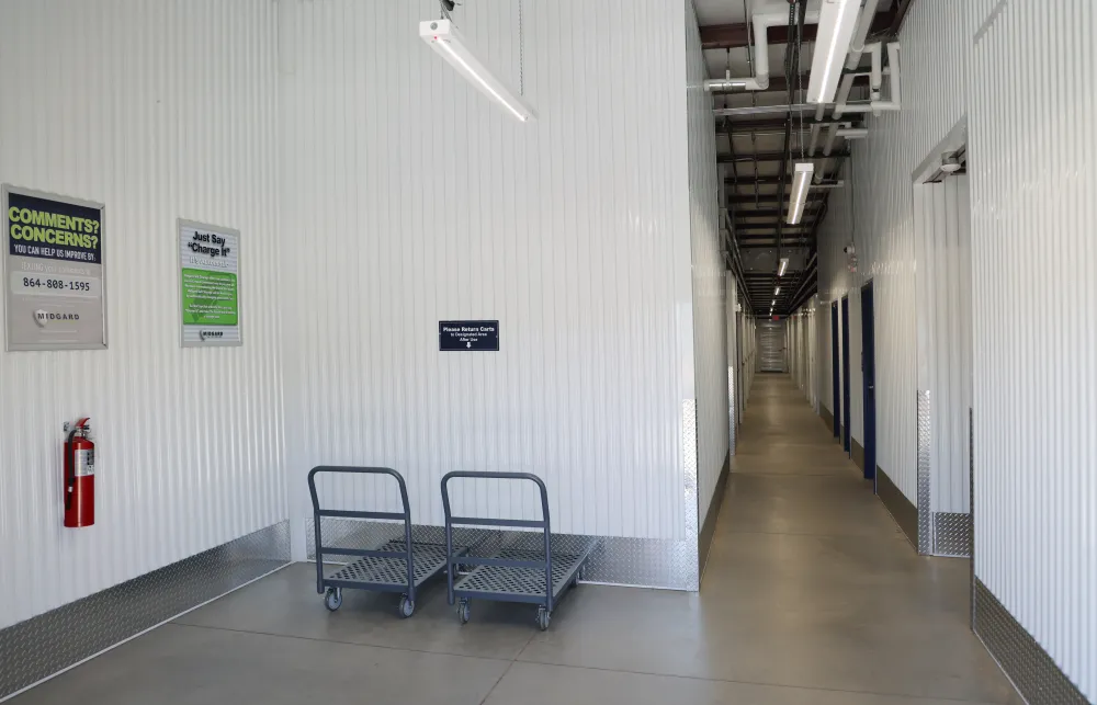 a room with a shopping cart and a fire extinguisher