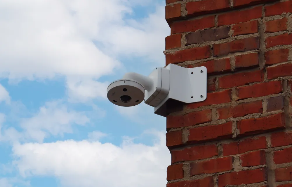 a camera on a brick wall