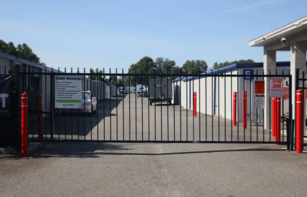 a gated off area with a car parked in the background