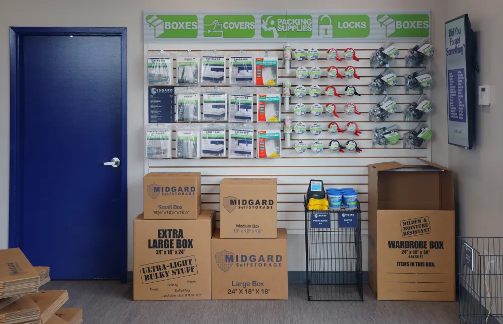 a store with boxes and a blue door