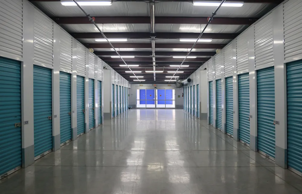 a long hallway with blue doors