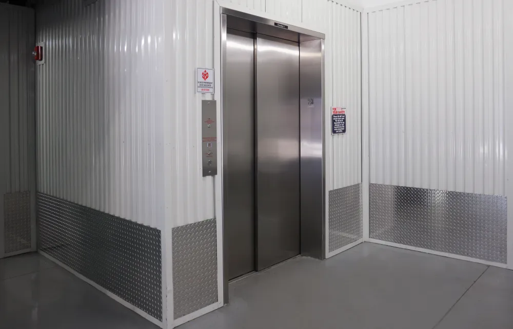 a large elevator with a glass door