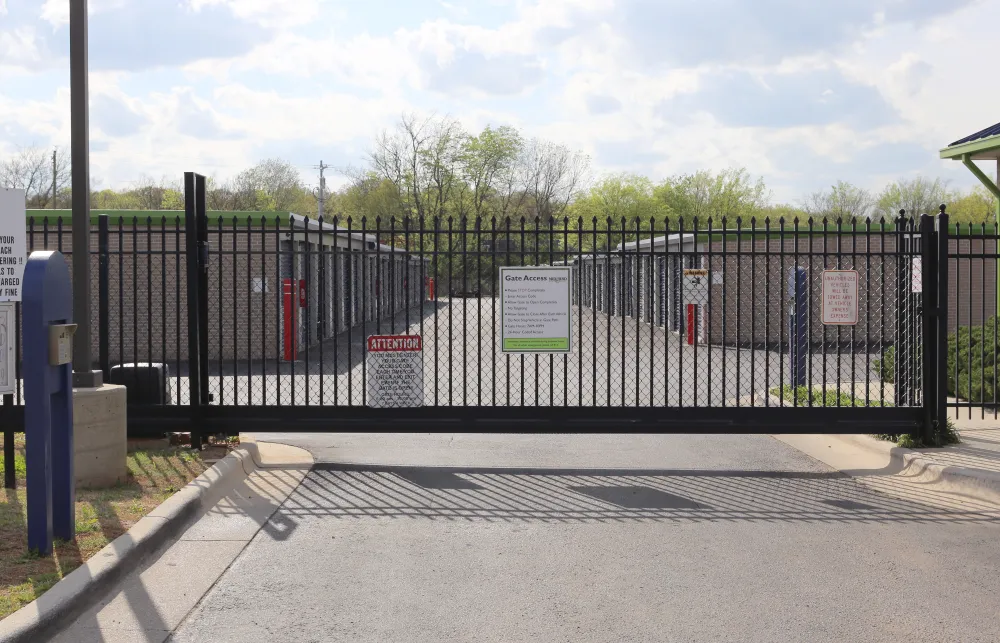 a black gate with a sign on it