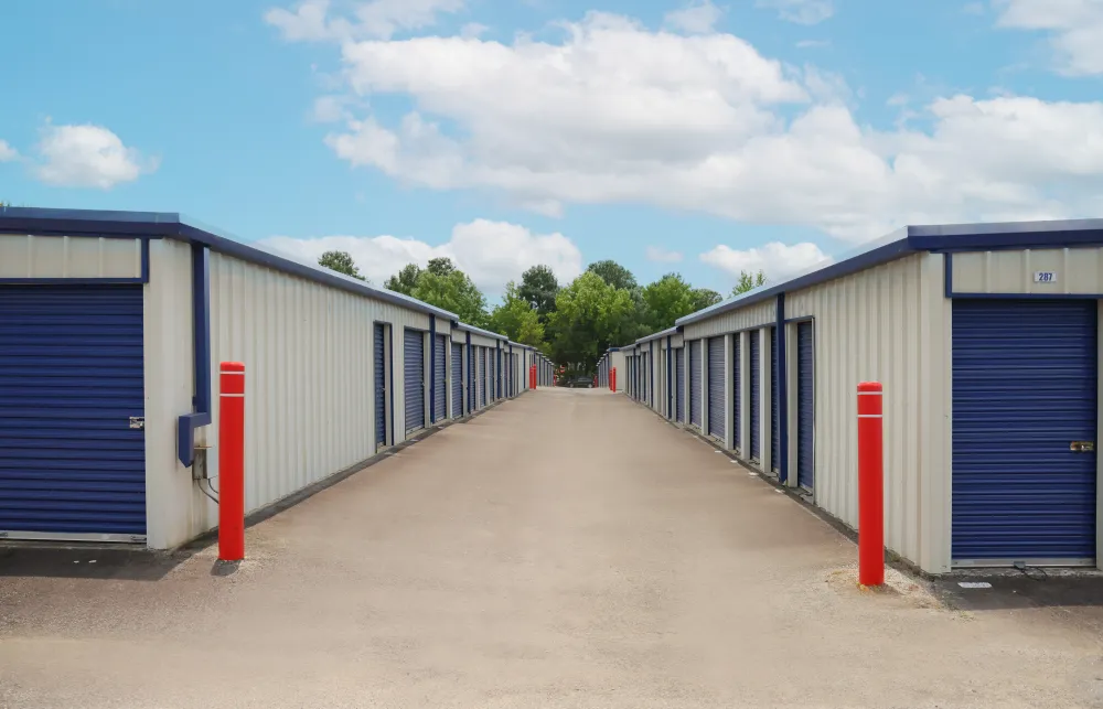 a row of blue and white sheds