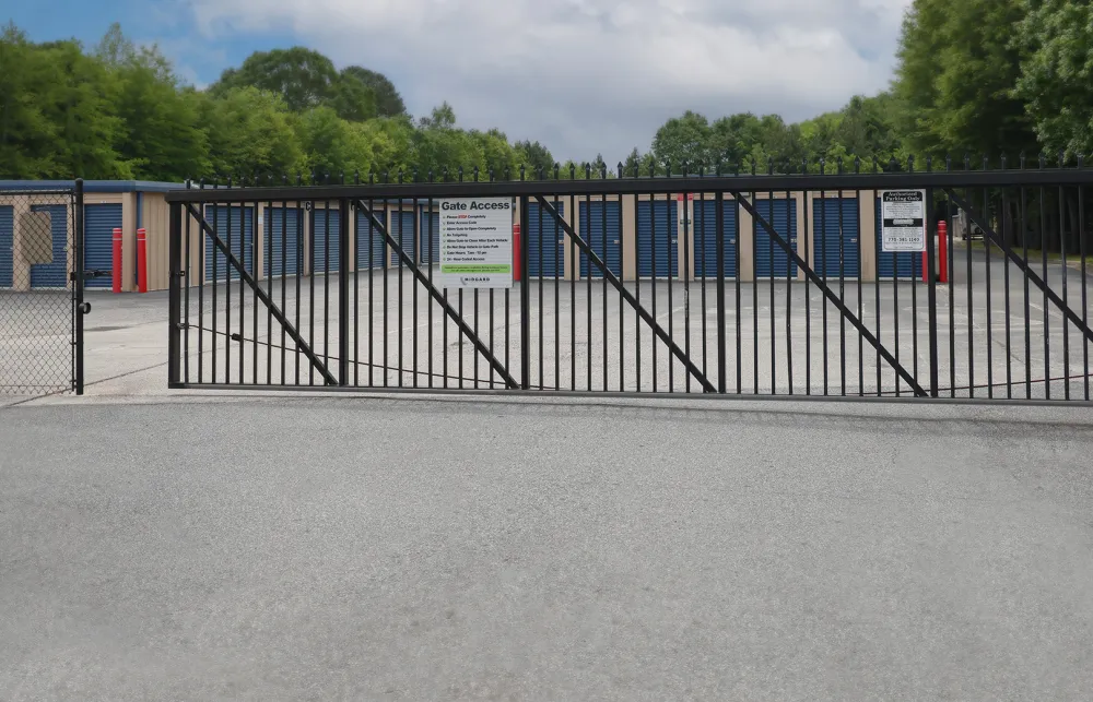 a black gate with a sign on it