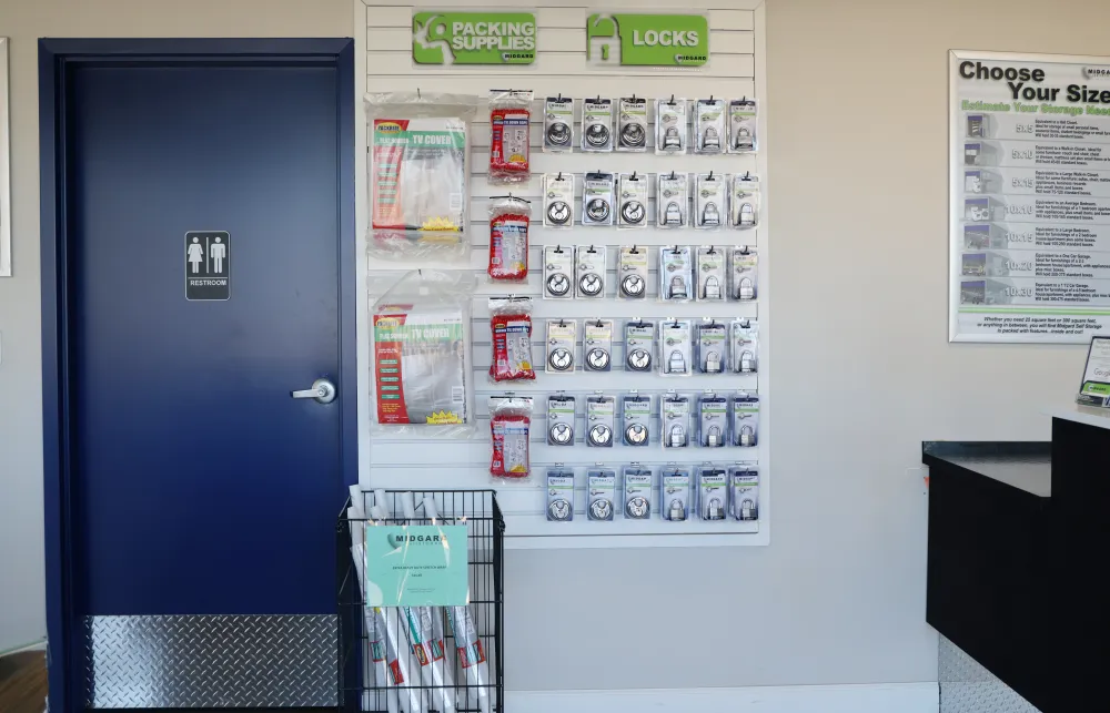 a wall with a sign and a door with a sign on it