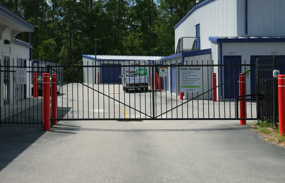 a gated off area with a bus parked in it